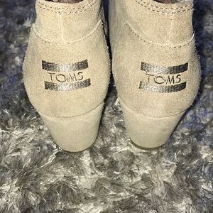 Brand new. Taupe Toms wedge booties. Never worn.